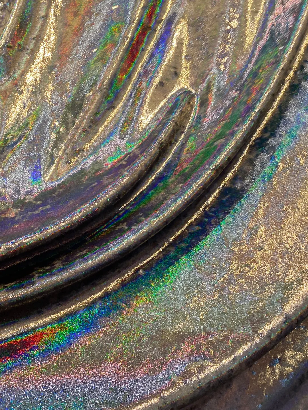 Velvet fabric with black iridescent, shiny mirror designs, stretches to all 4 sides sold by the yard
