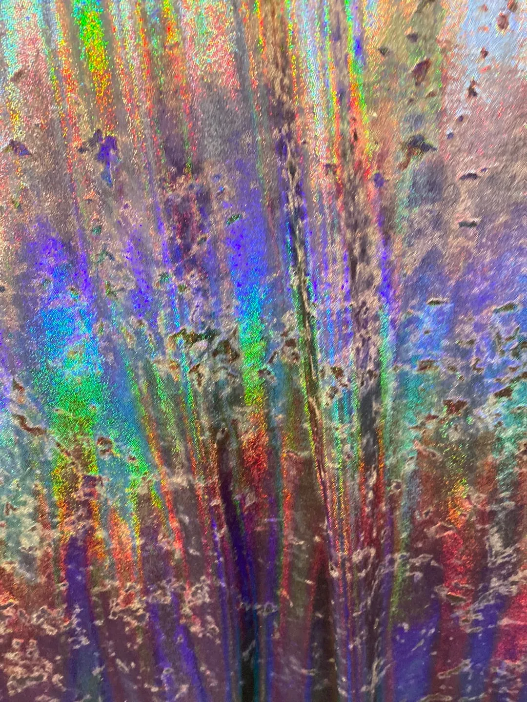 Velvet fabric with black iridescent, shiny mirror designs, stretches to all 4 sides sold by the yard