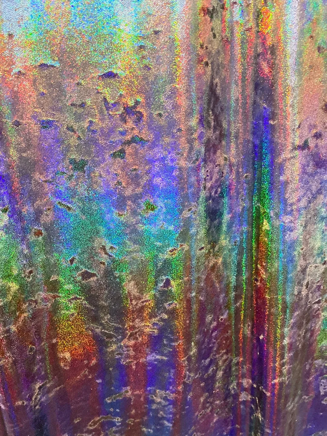 Velvet fabric with black iridescent, shiny mirror designs, stretches to all 4 sides sold by the yard