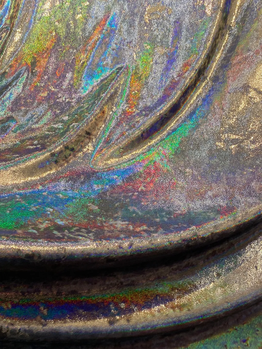 Velvet fabric with black iridescent, shiny mirror designs, stretches to all 4 sides sold by the yard