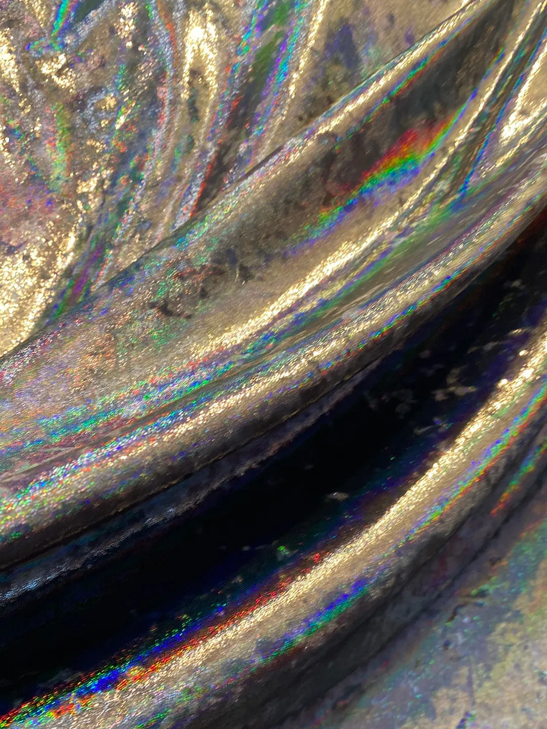 Velvet fabric with black iridescent, shiny mirror designs, stretches to all 4 sides sold by the yard