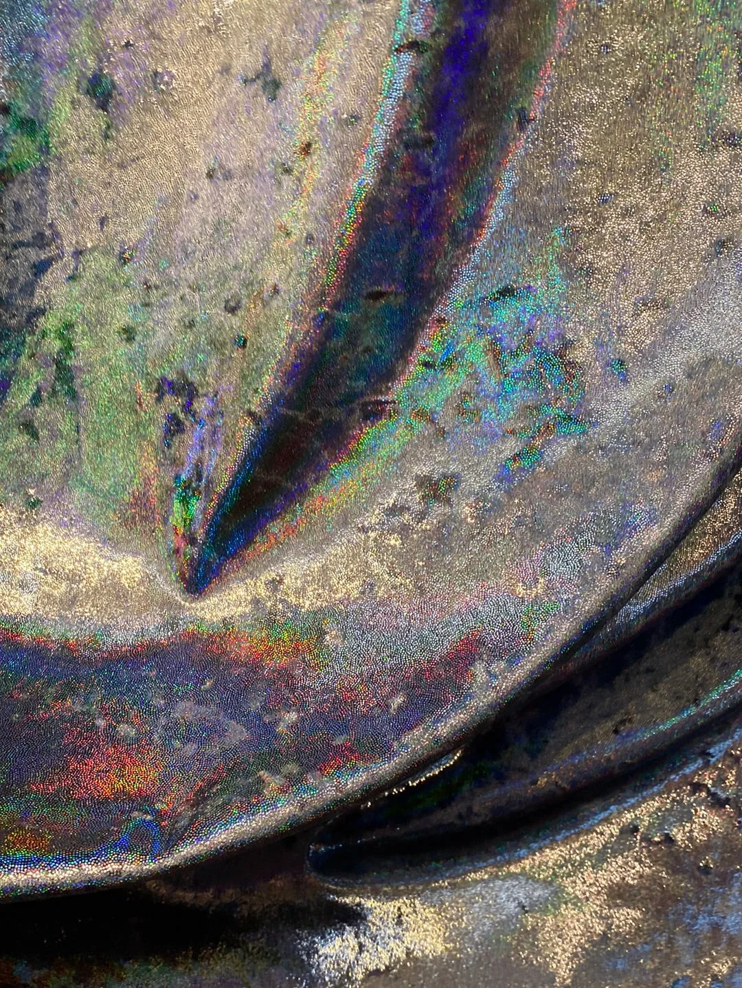 Velvet fabric with black iridescent, shiny mirror designs, stretches to all 4 sides sold by the yard