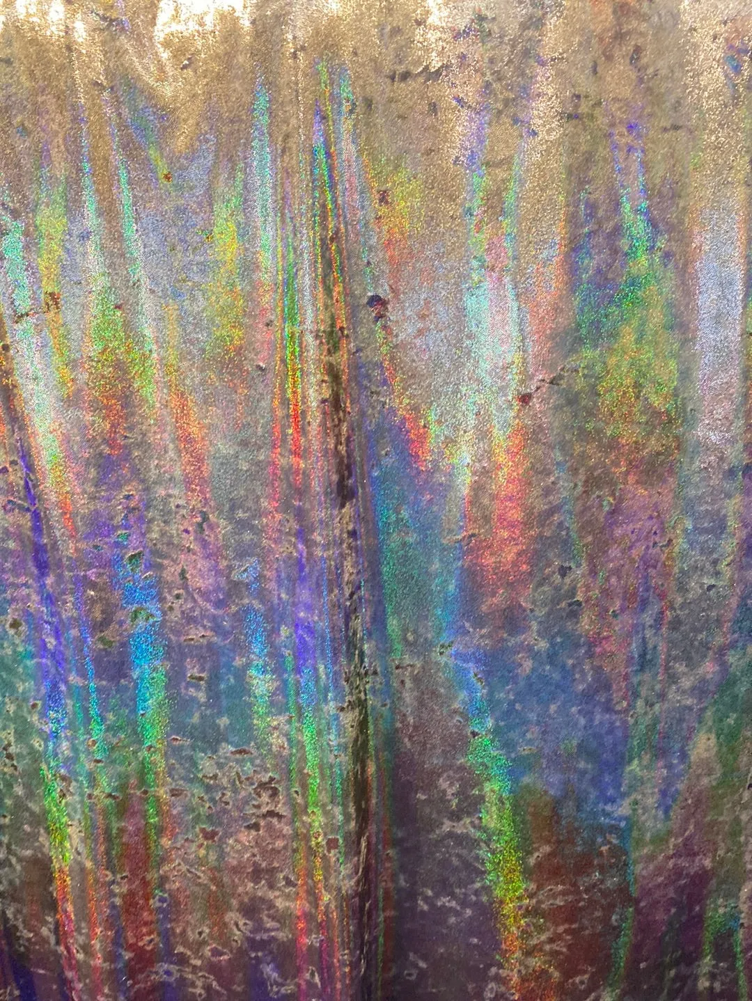 Velvet fabric with black iridescent, shiny mirror designs, stretches to all 4 sides sold by the yard