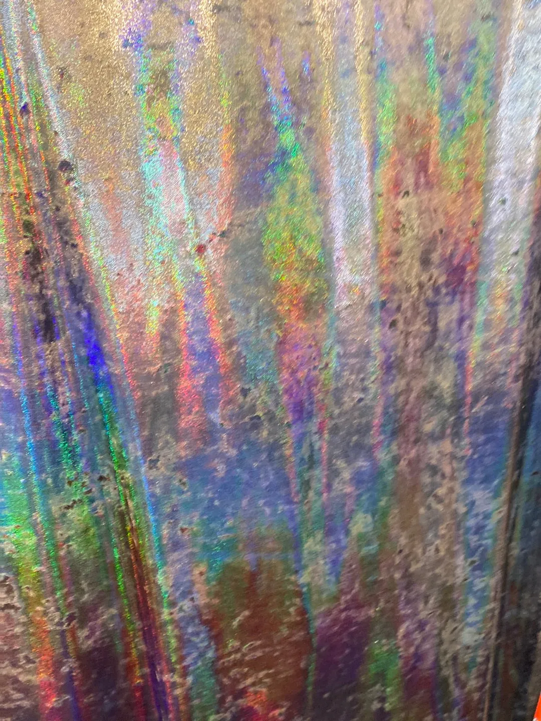Velvet fabric with black iridescent, shiny mirror designs, stretches to all 4 sides sold by the yard