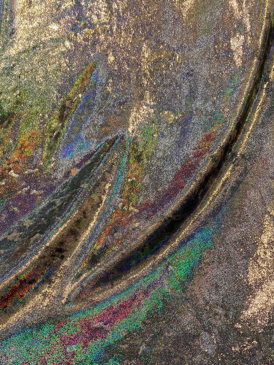 Velvet fabric with black iridescent, shiny mirror designs, stretches to all 4 sides sold by the yard