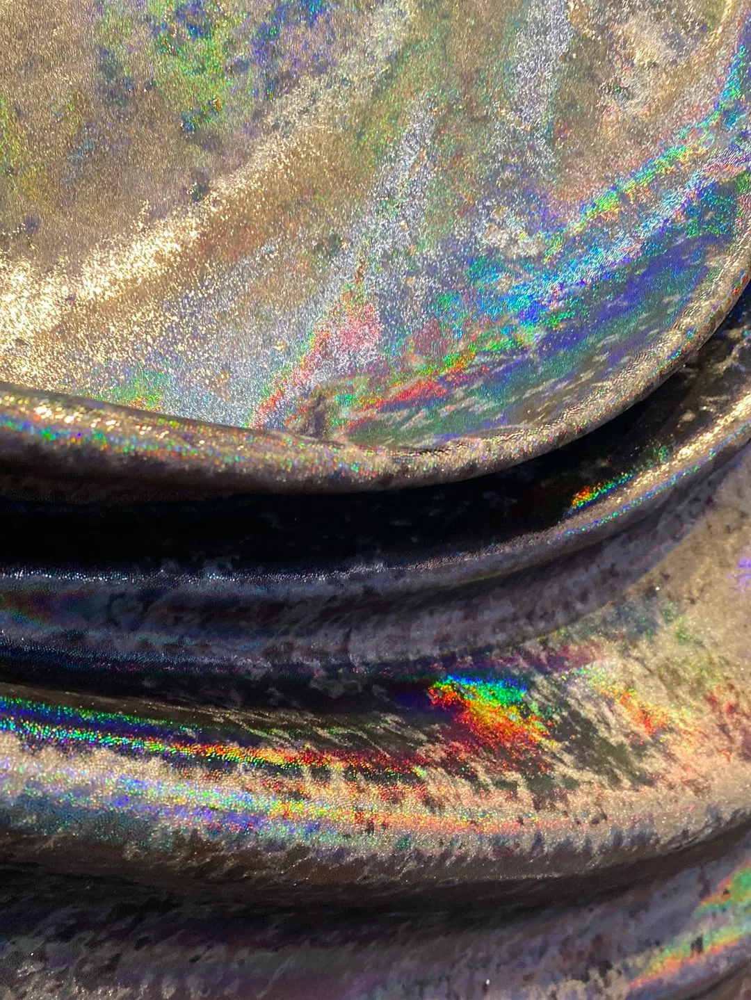 Velvet fabric with black iridescent, shiny mirror designs, stretches to all 4 sides sold by the yard