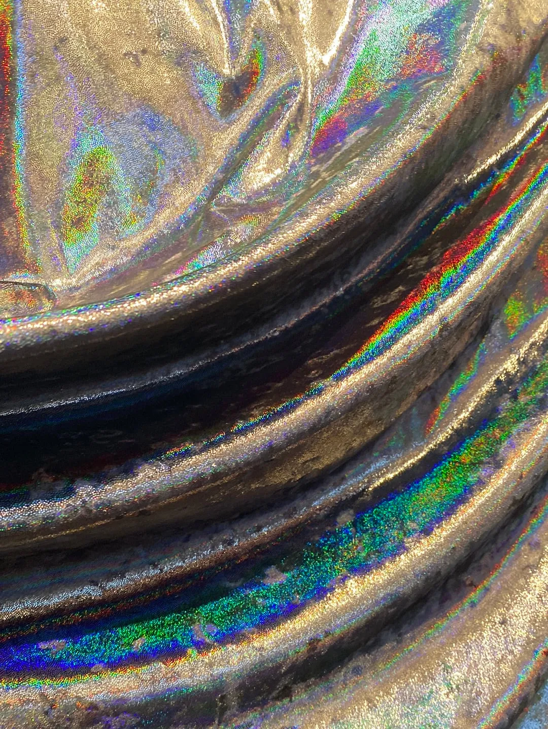 Velvet fabric with black iridescent, shiny mirror designs, stretches to all 4 sides sold by the yard